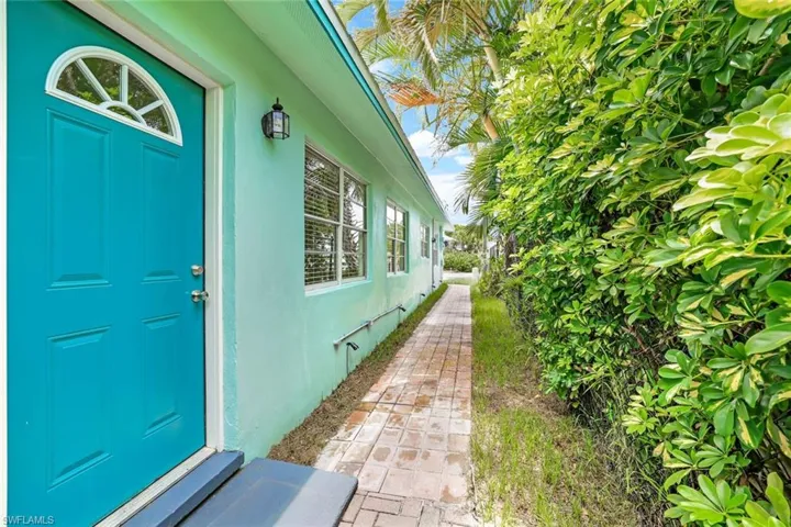 Entrance to property with stucco siding