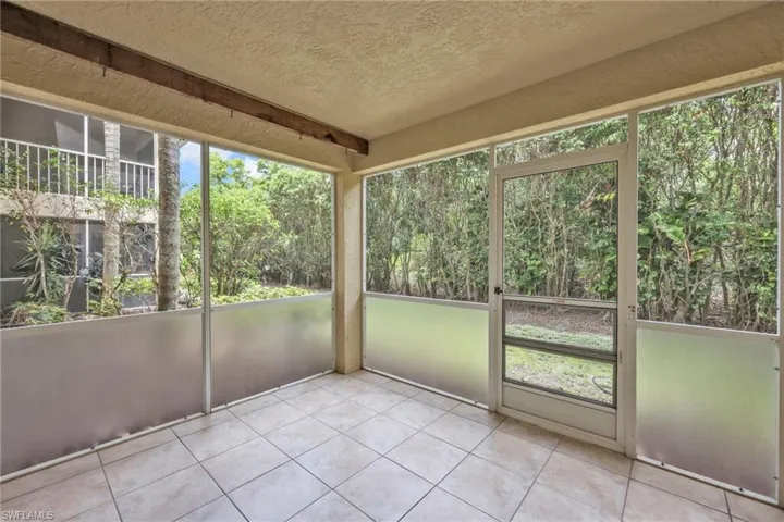 Unfurnished sunroom with healthy amount of natural light