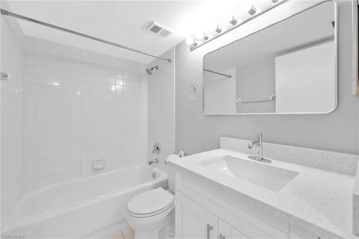 Full bath featuring shower / washtub combination and vanity