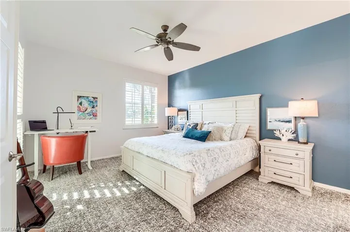 Bedroom with baseboards and ceiling fan