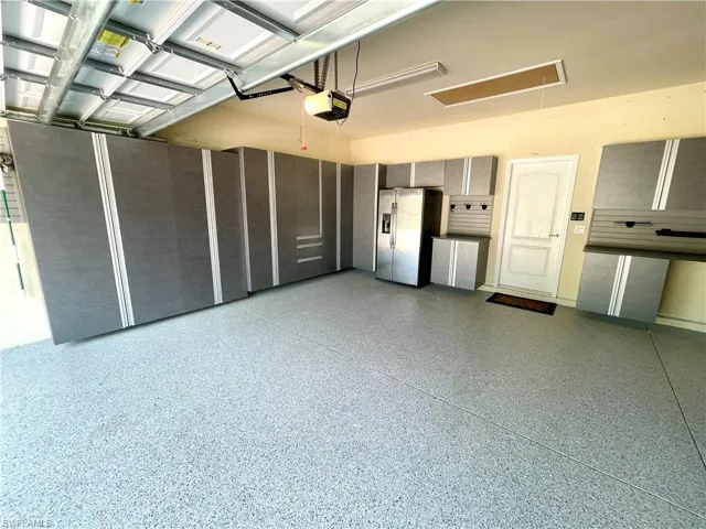 Garage with Built-ins and epoxy floor