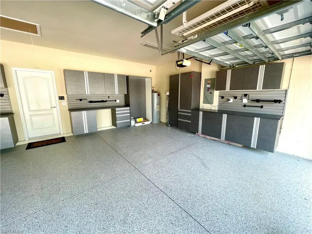 Garage with Built-ins ,epoxy floor and home water filtration system