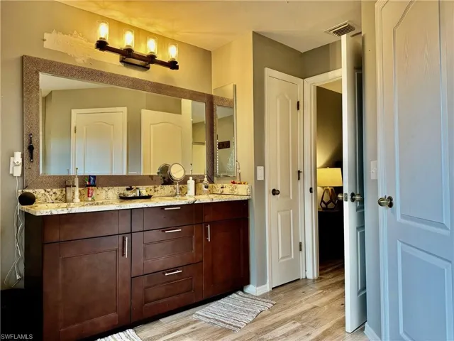 Bathroom featuring wood-type flooring and vanity