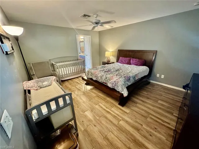 Bedroom featuring ceiling fan and light hardwood / wood-style floors