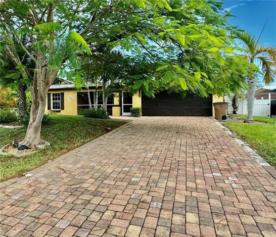 View of front of home featuring a garage
