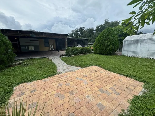 View of patio / terrace featuring a storage unit