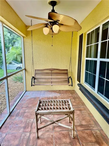 Sunroom / solarium with ceiling fan and a healthy amount of sunlight