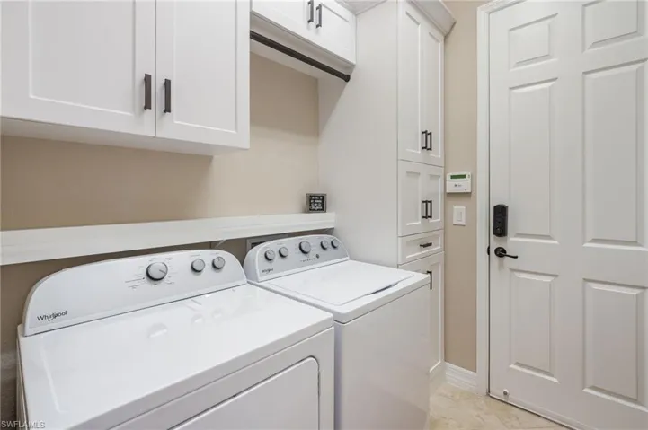 White shaker-style cabinetry with matte black hardware