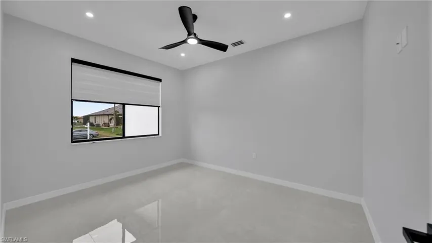Unfurnished room featuring ceiling fan and recessed lighting