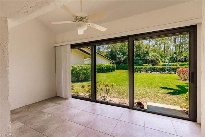 DEN/FAMILY ROOM VIEW BEYOND ENCLOSED LANAI