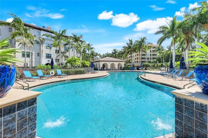 Community pool with a patio