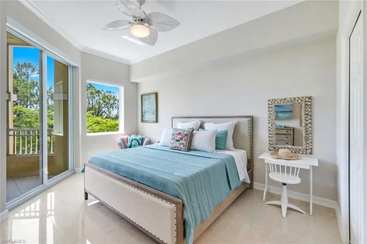 Bedroom with access to exterior, crown molding, baseboards, a ceiling fan, and light tile patterned floors