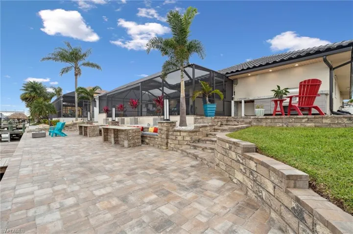 View of patio featuring glass enclosure