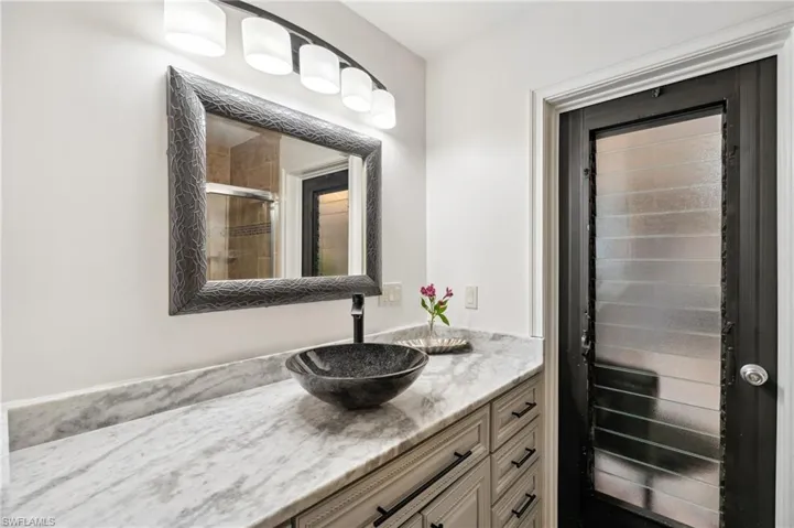 Bathroom with vanity and walk in shower