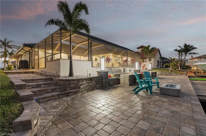 Patio terrace at dusk with a fire pit
