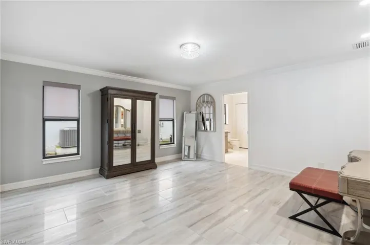 Spare room featuring crown molding