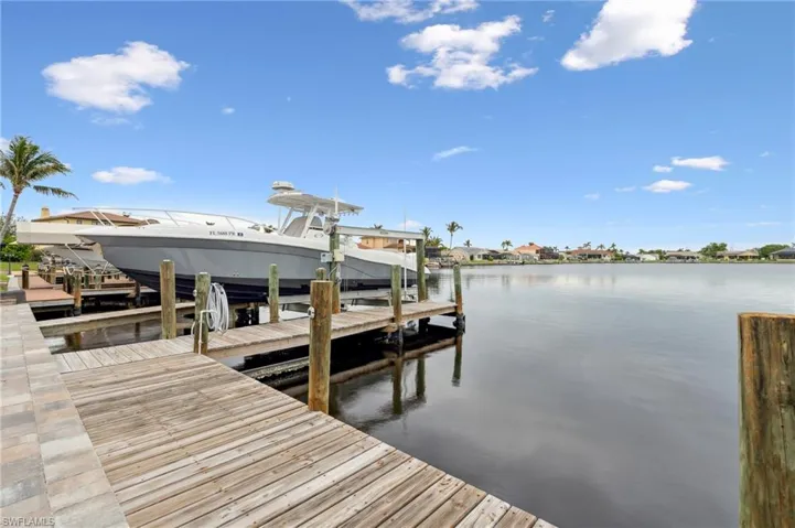 Dock area featuring a water view