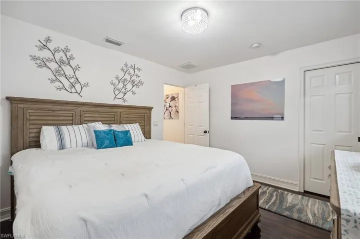 Bedroom featuring dark hardwood / wood-style flooring