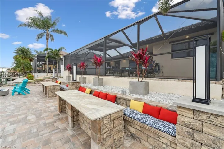 View of patio featuring a lanai