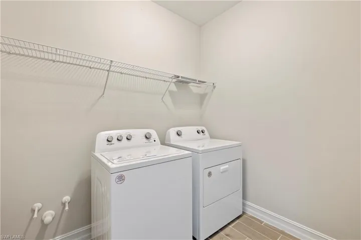 Laundry room featuring independent washer and dryer
