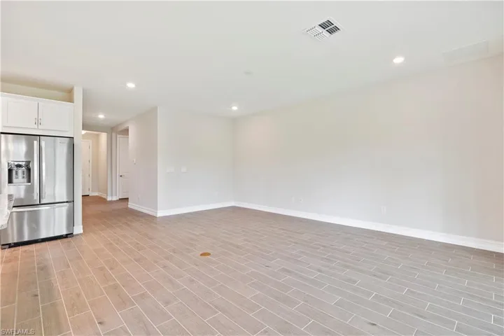 Unfurnished living room with light wood-type flooring