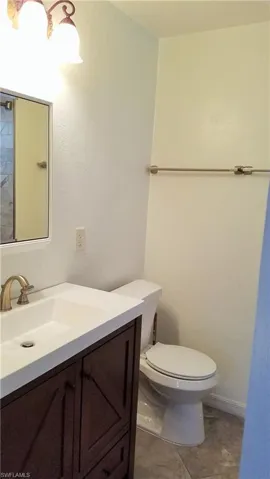 Bathroom with vanity and tile patterned floors