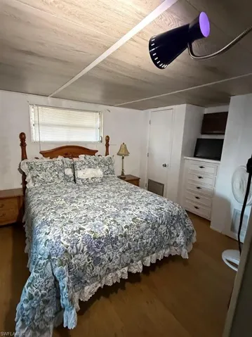 Bedroom with wood finished floors