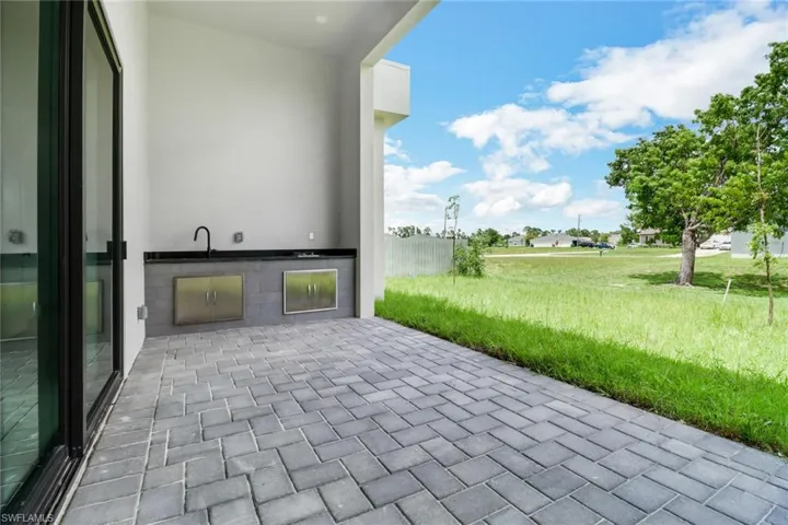 View of patio / terrace with sink and area for grilling