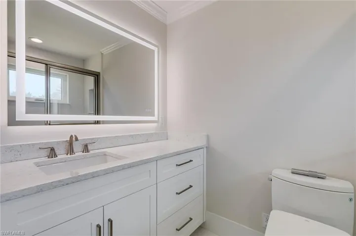Custom Quartz Countertops in Every Wet Area, Including this Guest En-Suite