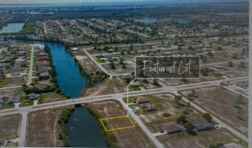 Aerial overview of property's location with property boundaries highlighted and a large body of water