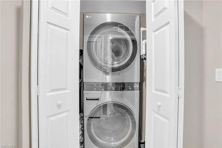 Laundry area with stacked washer / drying machine