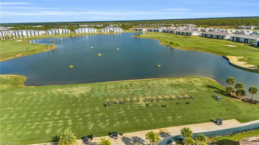 Bird's eye view of a local golf course and a large body of water