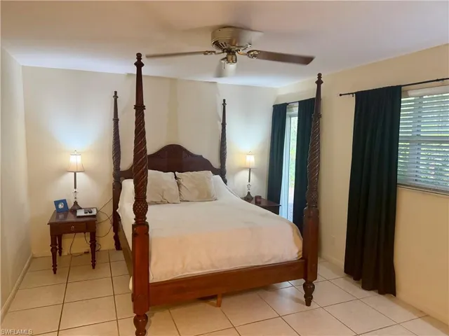 Bedroom featuring a ceiling fan and light tile patterned flooring