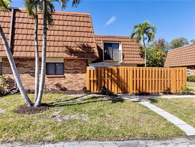 View of side of home with a lawn
