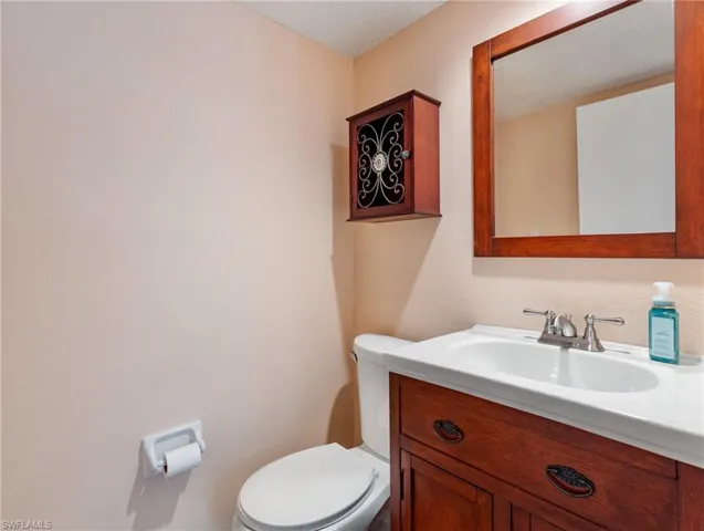 Half Bathroom with vanity and toilet