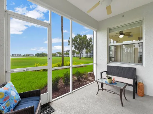 Sunroom / solarium featuring a ceiling fan