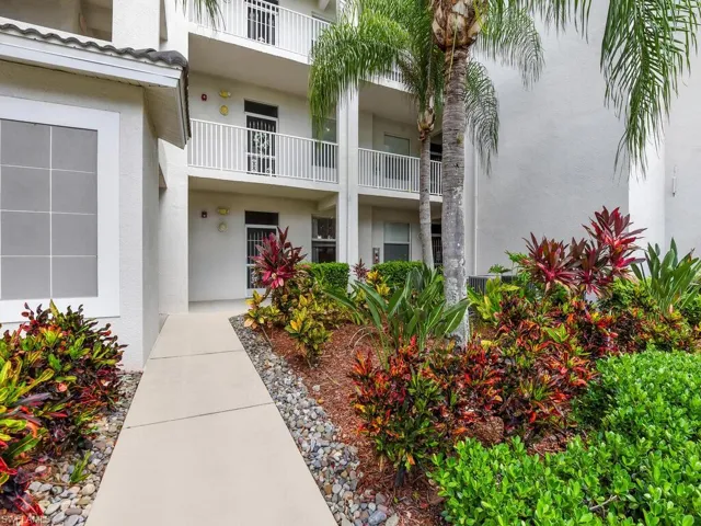 Entrance to property with stucco siding
