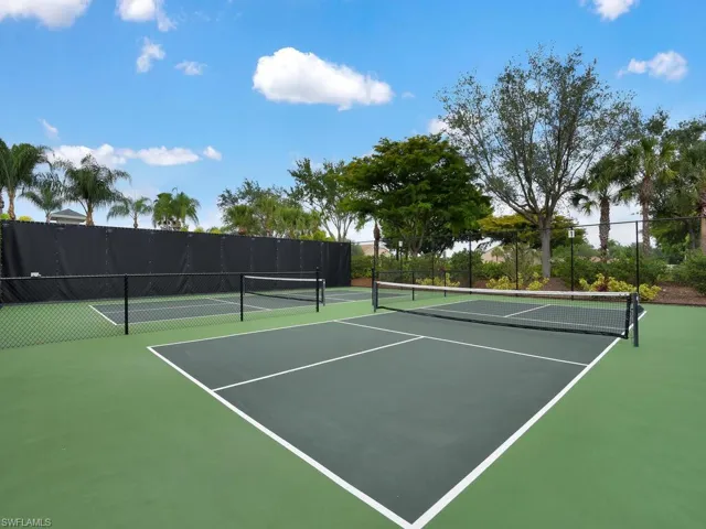 View of tennis court featuring community basketball court