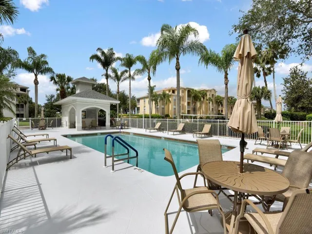 Community pool featuring a patio and a gazebo