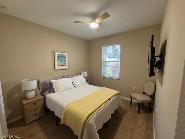 Bedroom featuring wood finished floors and a ceiling fan