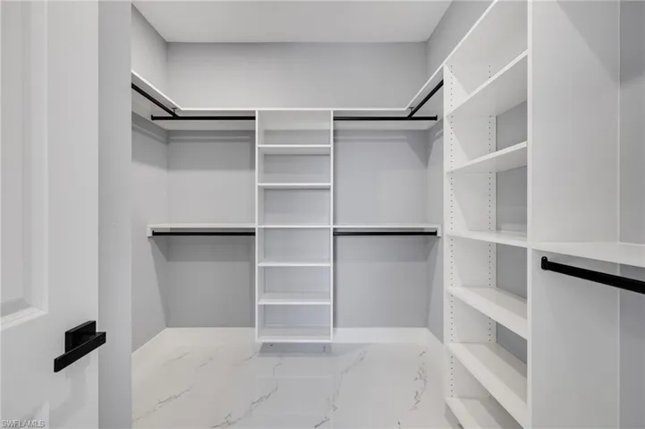 View of master walk in custom closet