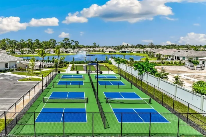 View of sport court featuring a water view