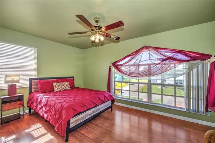 Bedroom featuring a ceiling fan and wood finished floors