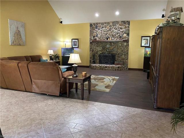 Living room with wood burning fireplace