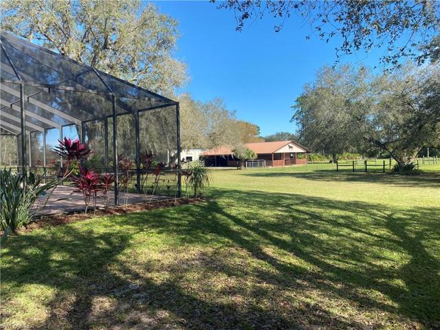 Screened back porch, back yard, and barn