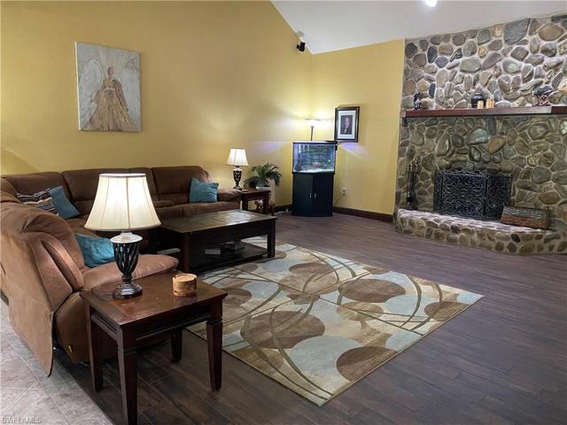 Living room with wood burning fireplace