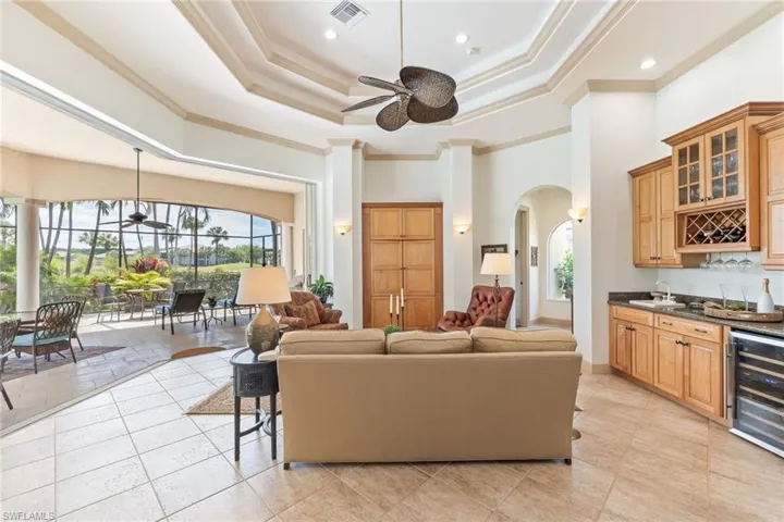 Family room with beverage center and 5 panel recessed sliders