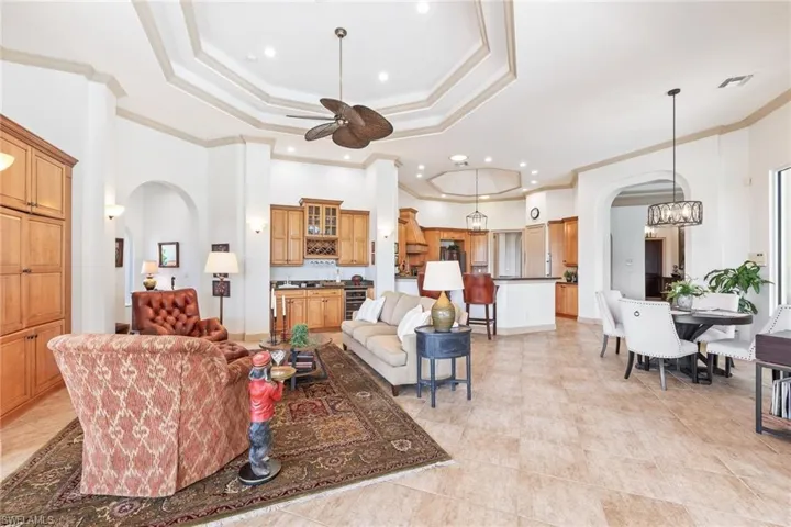 Family room with beverage center with view of open kitchen