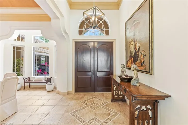 Entryway with solid wood doors throughout