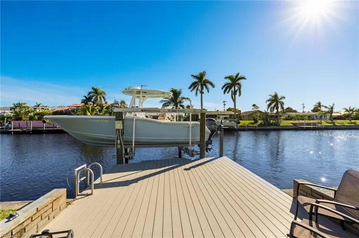 Newer dock with 10,000# remote controlled boat lift with swing stoppers!
